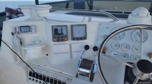 Boat control panel with a Raymarine ST60 instrument protected by a custom sun cover