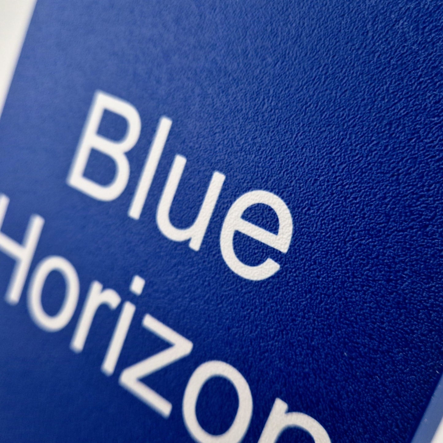 A personalized boat name displayed on a marine instrument cover