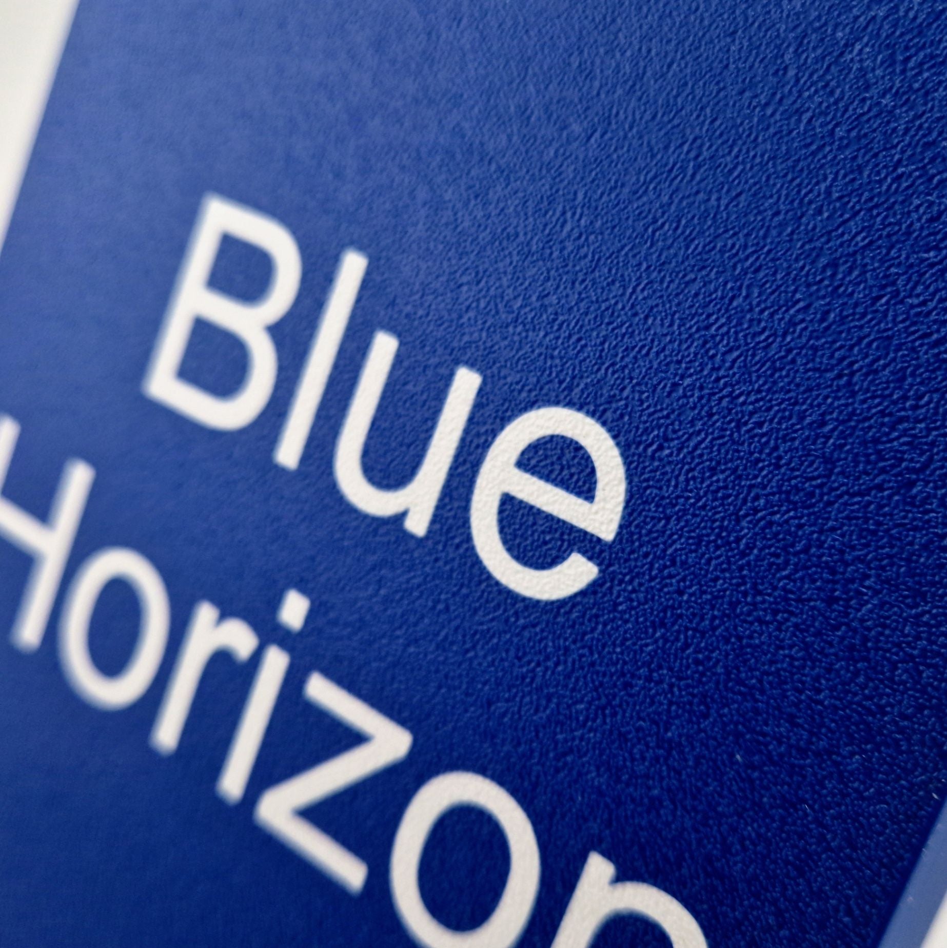 A personalized boat name displayed on a marine instrument cover