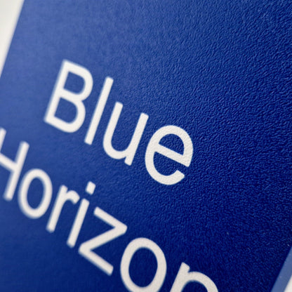 A personalized boat name displayed on a marine instrument cover