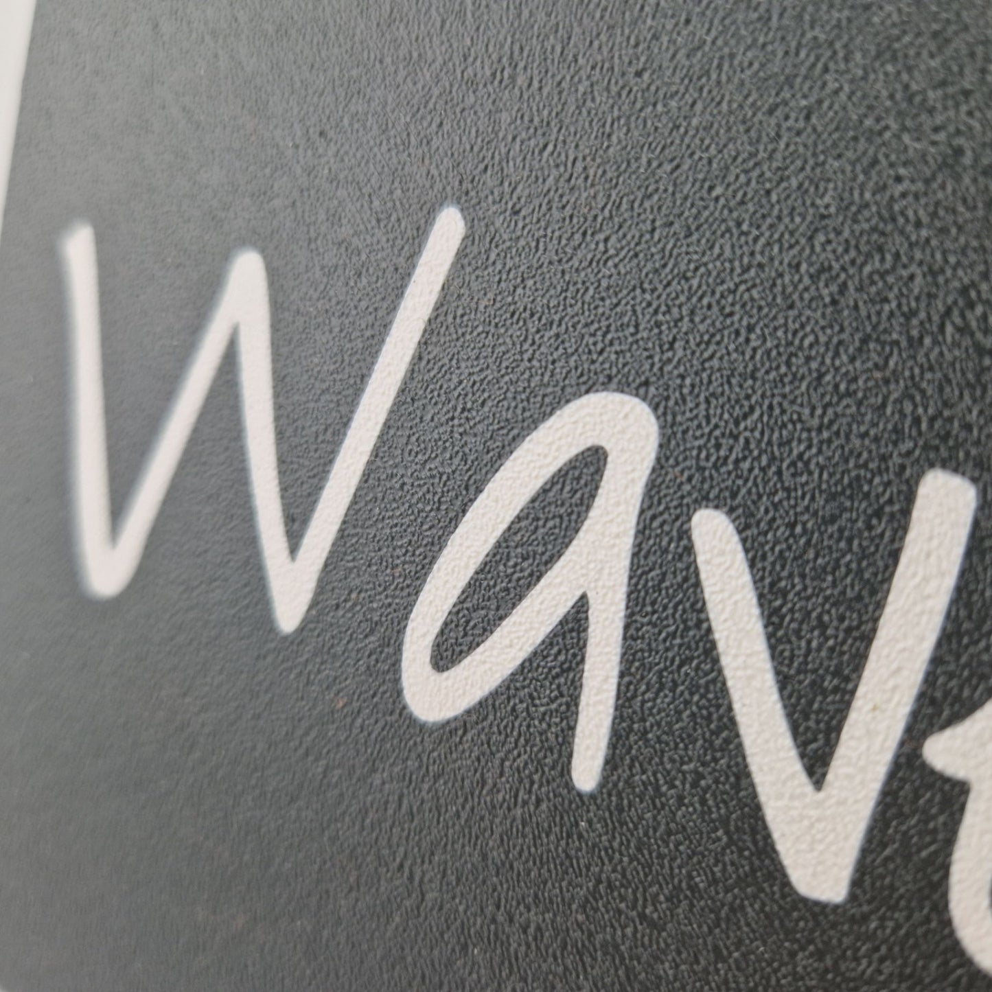 Boat name engraved in white on a cover