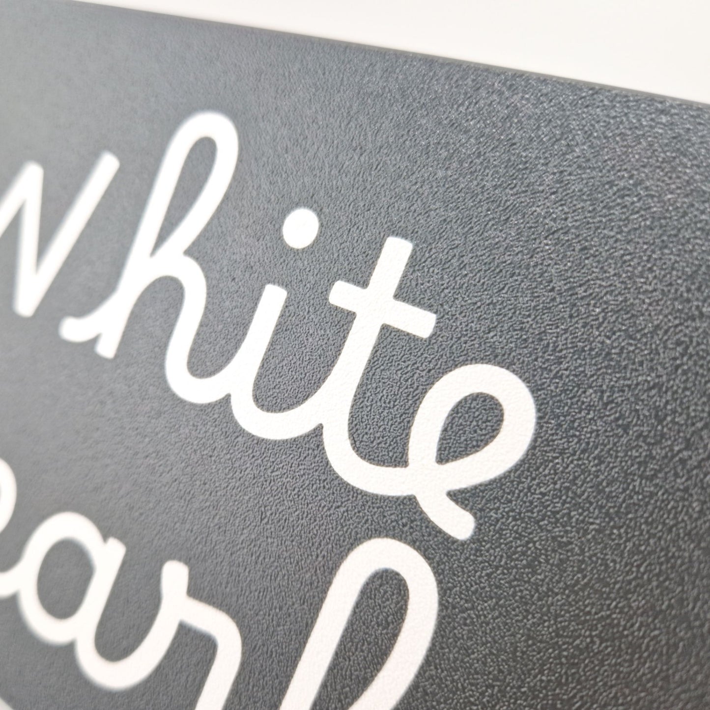 Personalised engraving of a boat name on a suncover