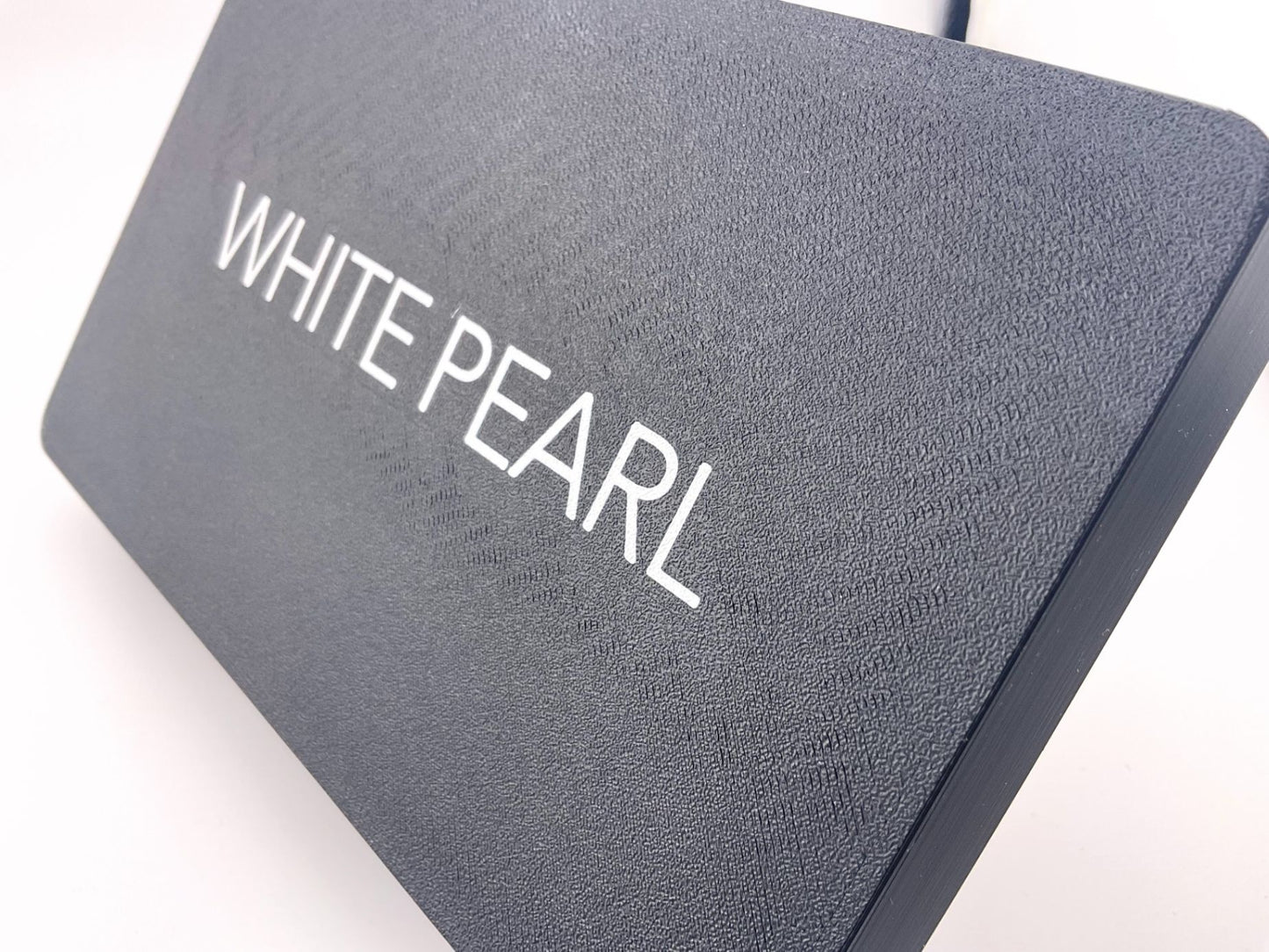 Suncover with a bright highlight on engraved text