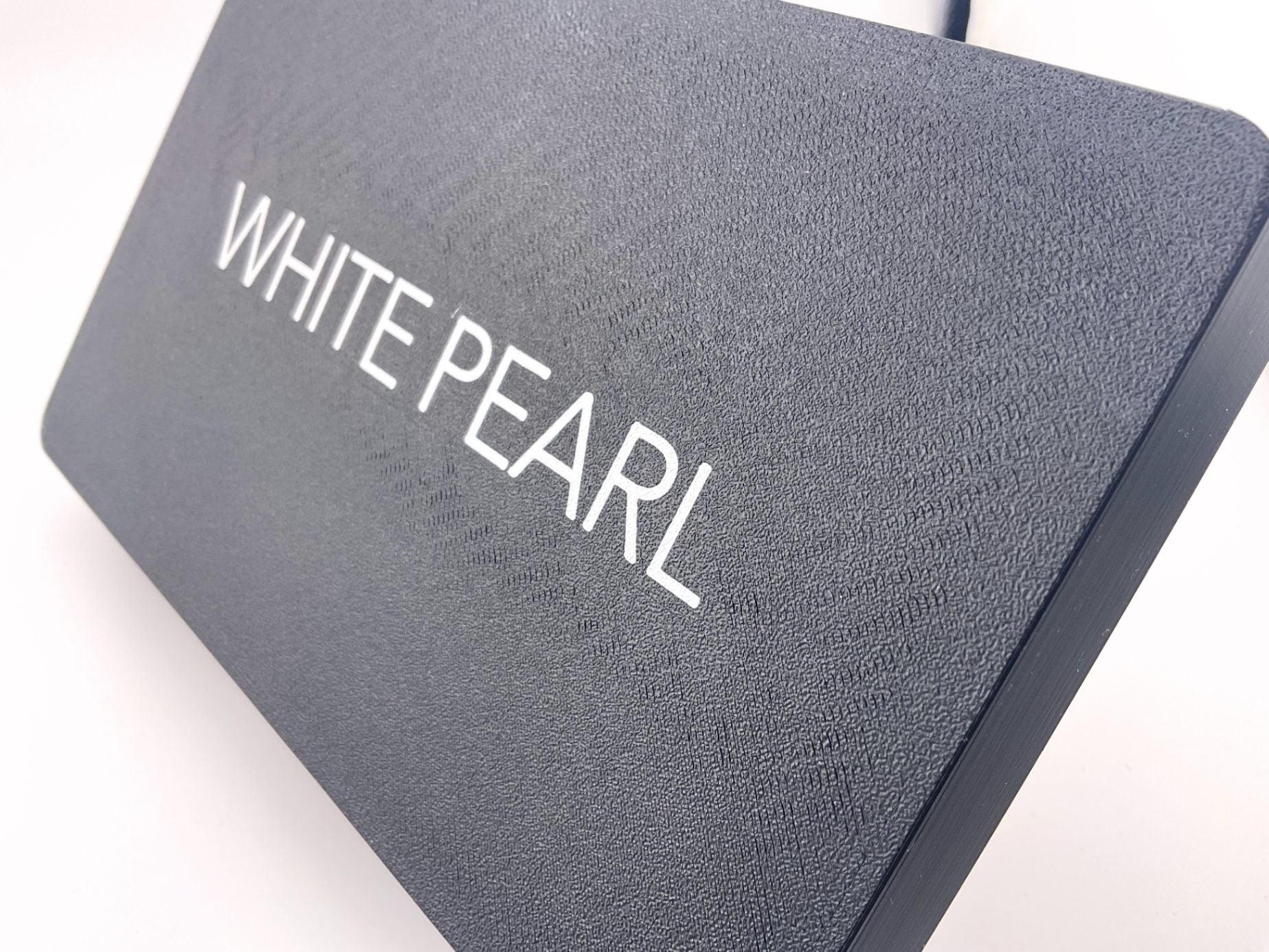 Suncover with a bright highlight on engraved text