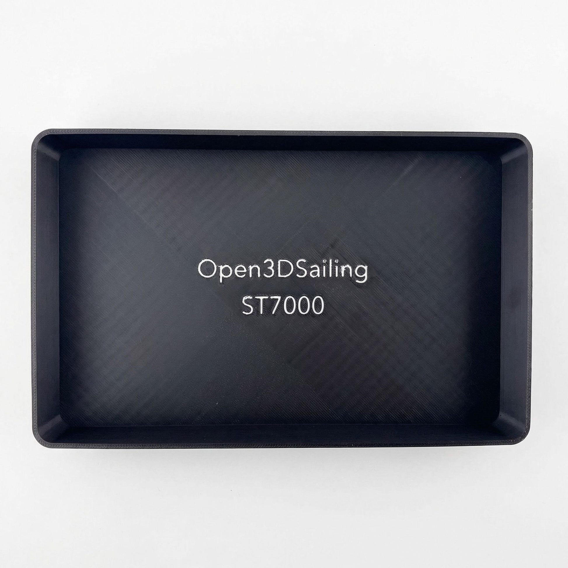 Rear view of a Raymarine ST7000 marine instrument with its suncover protection attached.