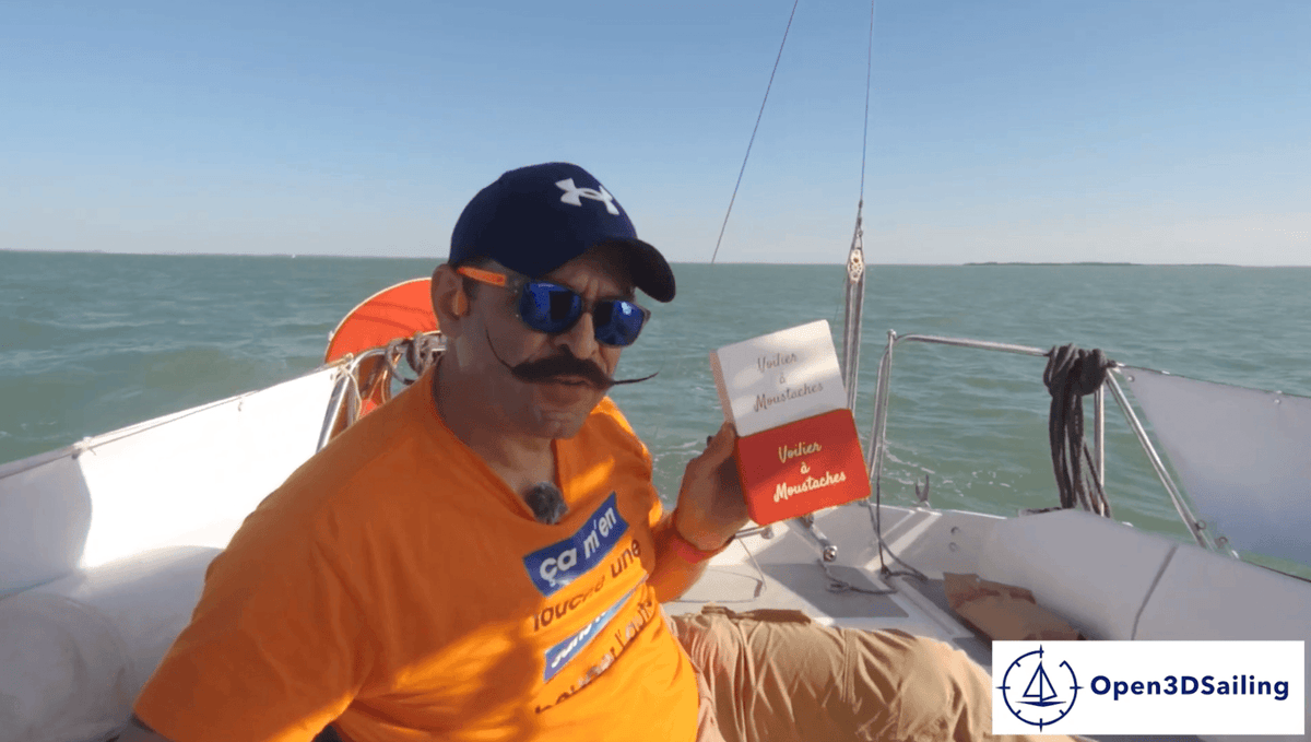 A YouTuber with a mustache presenting a suncover for a sailboat.